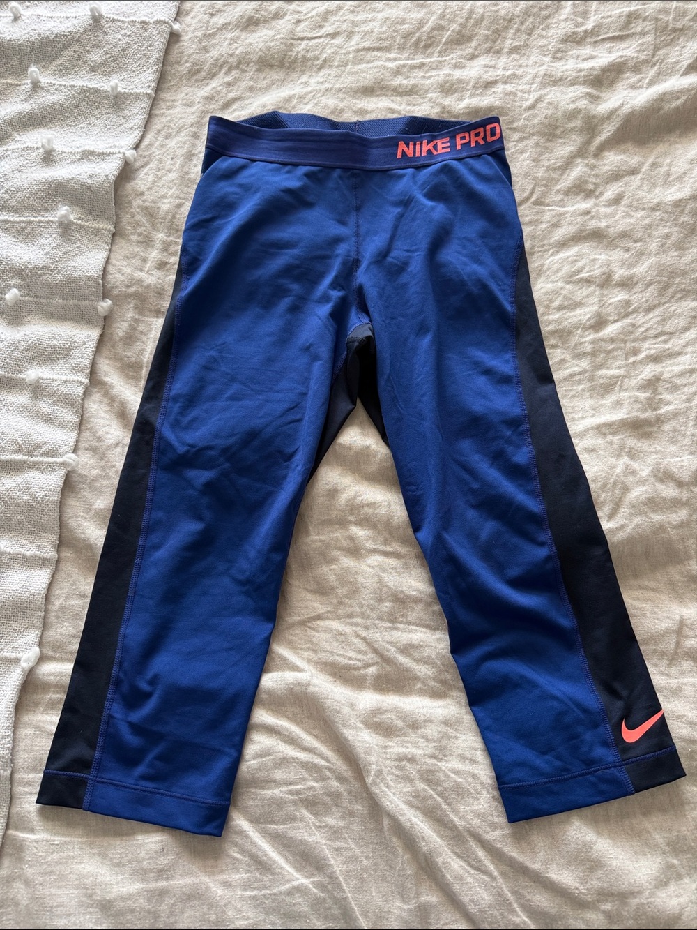 Nike Blue Cropped Leggings with Black Side Panels and Coral Accent